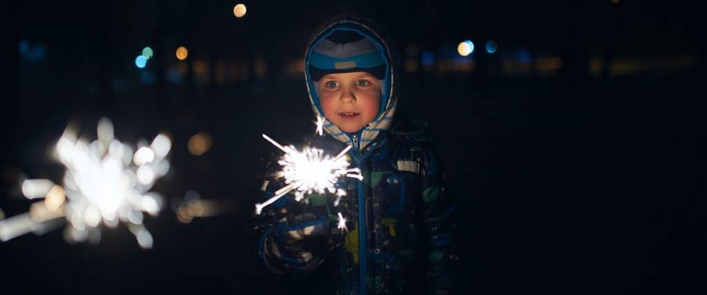 new years activity for kids child with sparkler