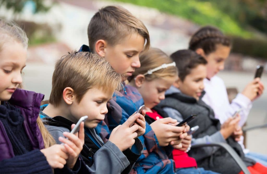 Group of Kids on phones