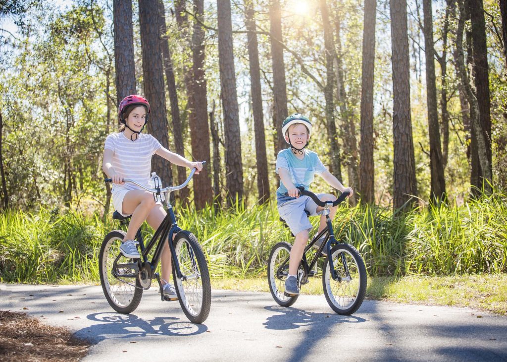 Two kids riding bikes