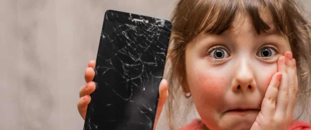 little girl with broken phone