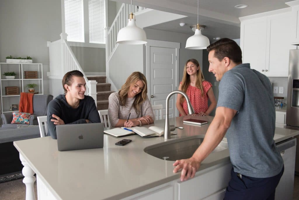 Family taking about healthy cell phone use with their kids