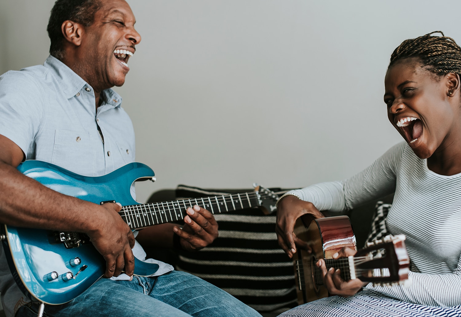 Father daughter playing guitar