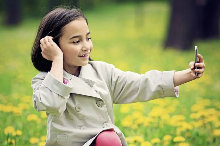 Little girl taking selfie