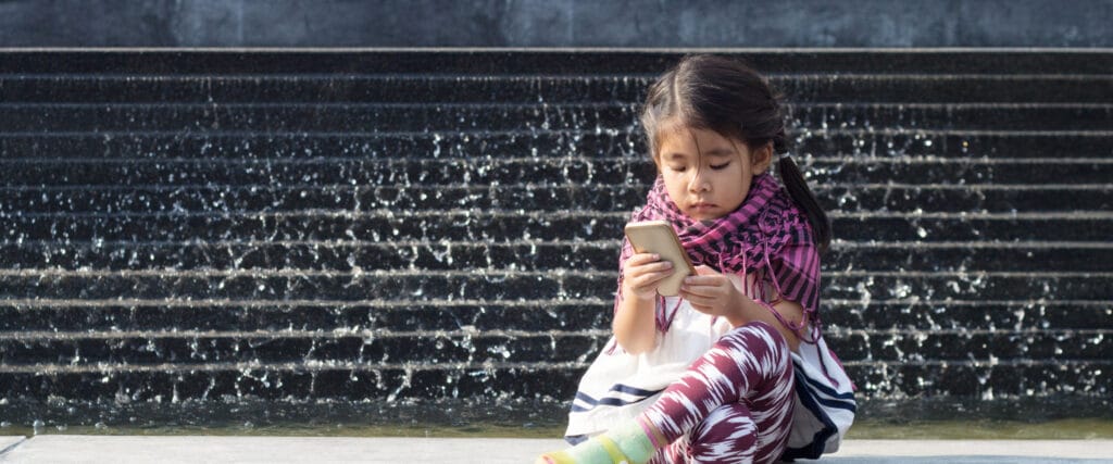 little girl on cell phone