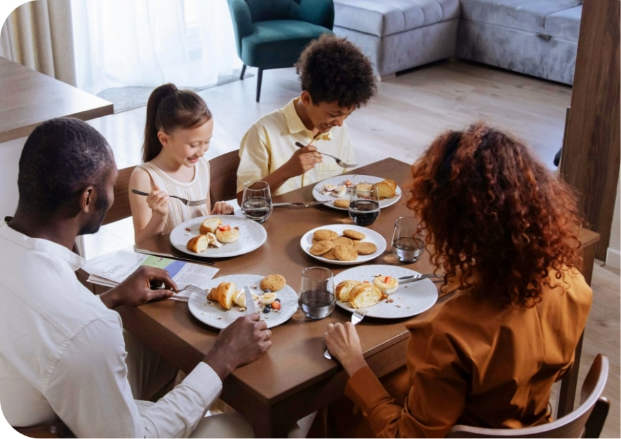 happy family eating a meal together