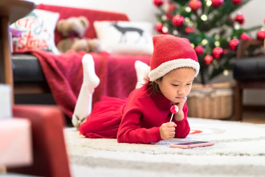 little girl watching a show on a smartphone