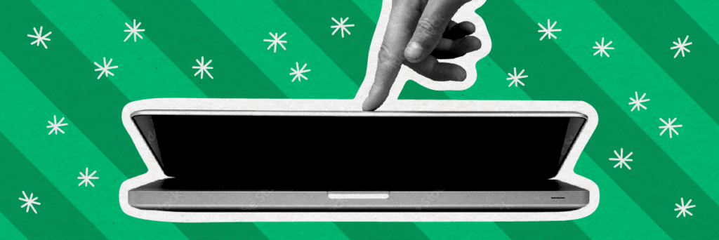 hand closing laptop with holiday background
