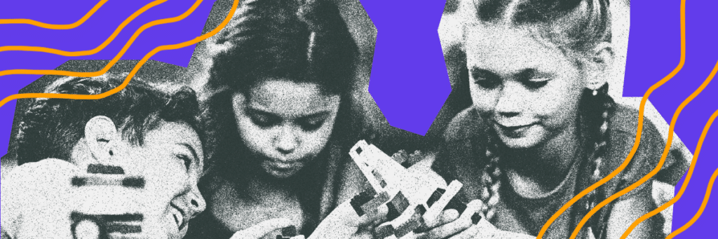 three little kids looking at technology