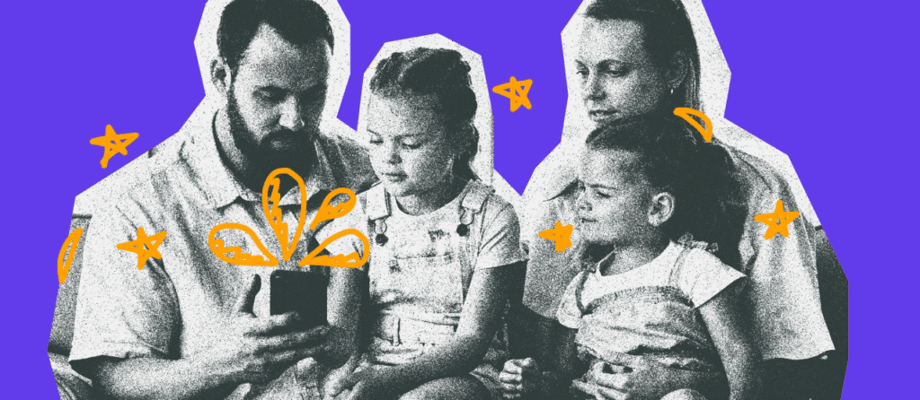 Family of four with dad holding a phone.