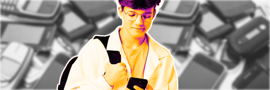 teen boy looking at cell phone