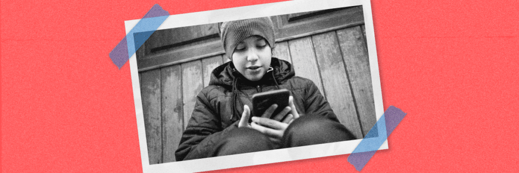 gen alpha boy looking at smartphone