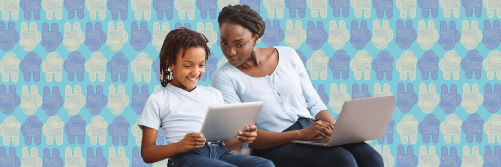 mom and daughter looking at tablet