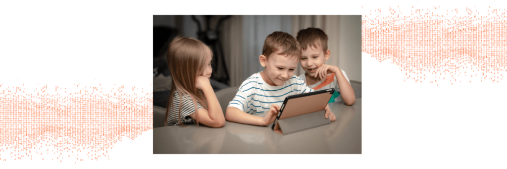 little kids playing on a tablet