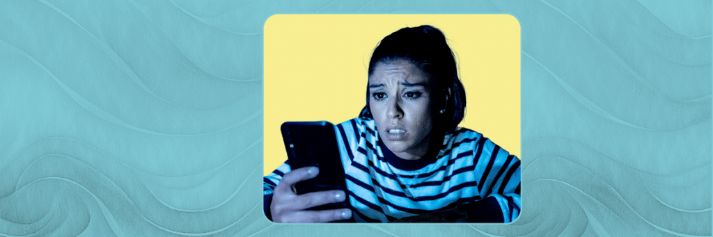 concerned girl looking at her phone