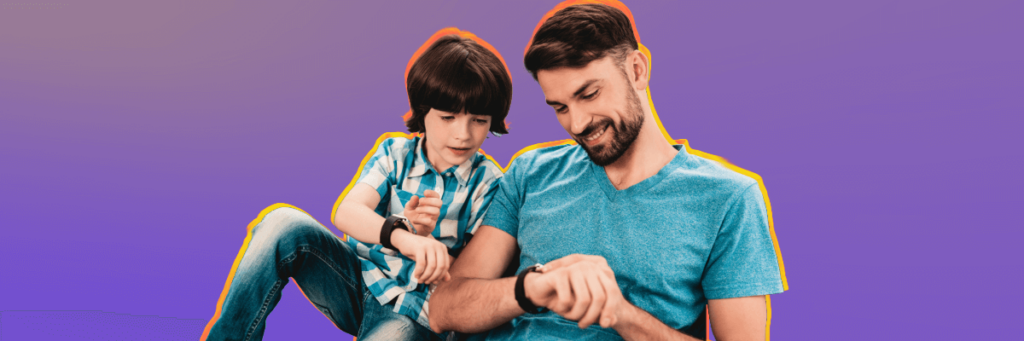 father and son looking at their smart watches