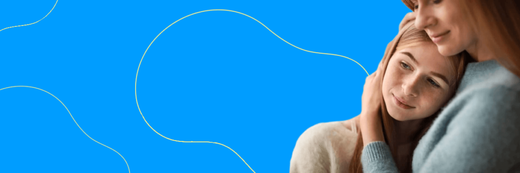 mom hugging daughter