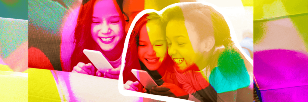 little girls smiling at kids cell phone