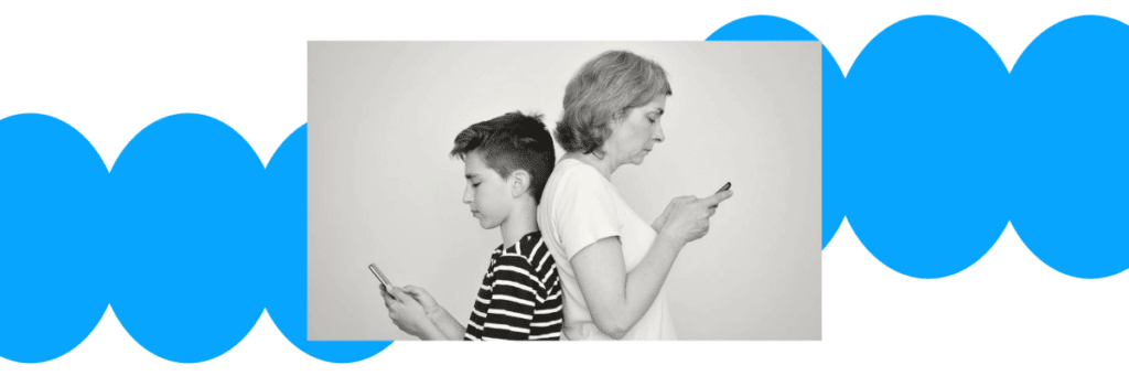 mother and son back to back looking at cellphones