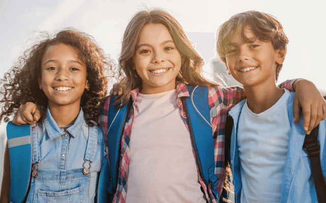 Three kids smiling