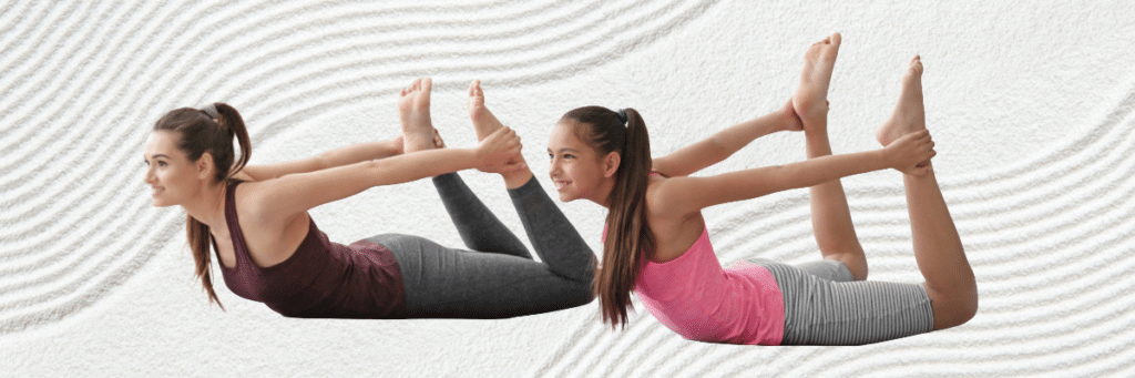 two girls doing yoga poses