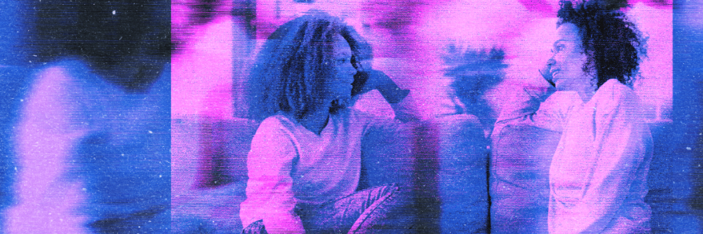 mother and daughter sitting on the couch talking