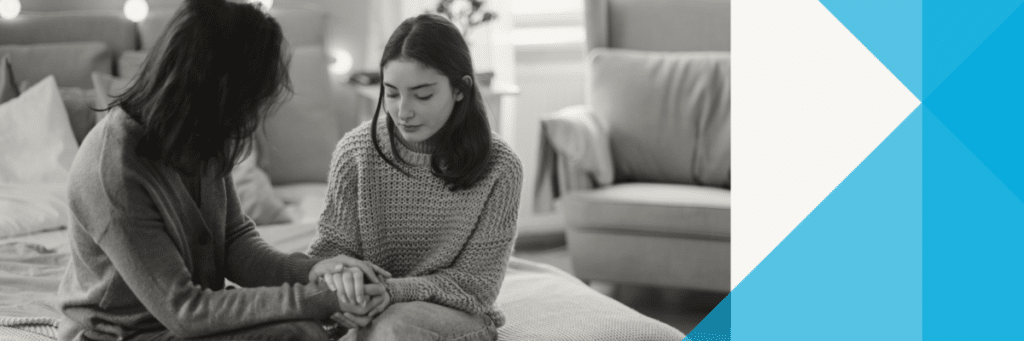 mother and daughter holding hands while talking
