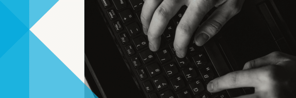 hands typing on a laptop
