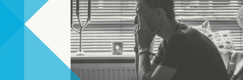 teen boy with hands over his eyes