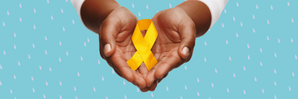 yellow ribbon in someone's hands for suicide prevention