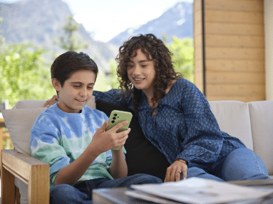 mom and son looking at cell phone