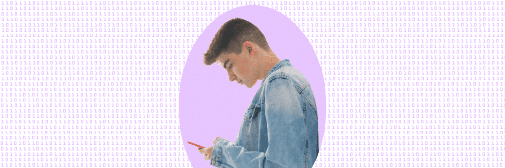 teen boy looking down at smartphone