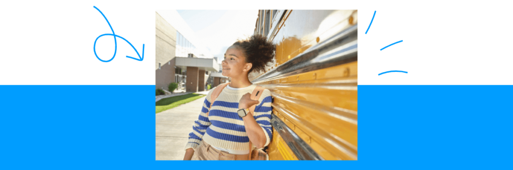 teen girl with Gabb Watch leaning against school bus outside of high school