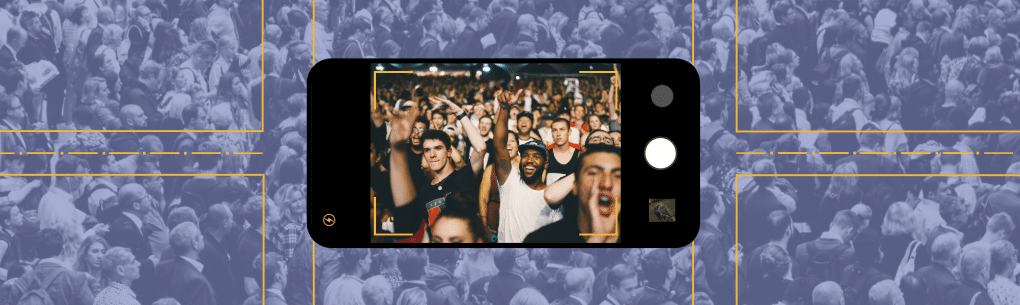 phone camera taking picture of a cheering crowd