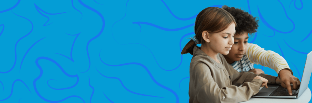 two young kids on a laptop